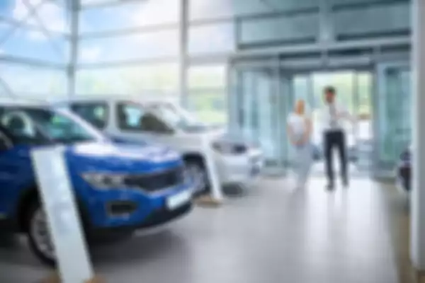 salesman-showing-various-cars-to-female-client-at-2026-01-09-07-20-59-utc.JPG